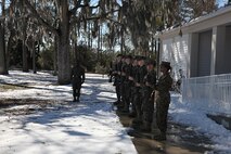 Marines with 2nd Supply Battalion, 2nd Marine Logistics Group, II Marine Expeditionary Force conduct present arms during the playing of taps at Marston Pavilion during a memorial ceremony aboard Camp Lejeune, N.C., Jan. 31, 2014. Lance Cpl. Nicholas S. Buscarnera, 19, a Mastic Beach, N.Y., native and an ammunition technician with 2nd Supply Bn., 2nd MLG and Pfc. Skyler D. Way, 19, a Gouverneur, N.Y., native and an ammunition technician with battalion were both found dead Jan. 7 as a result of a single vehicle incident that occurred along Catfish Lake Rd., Havelock, N.C.