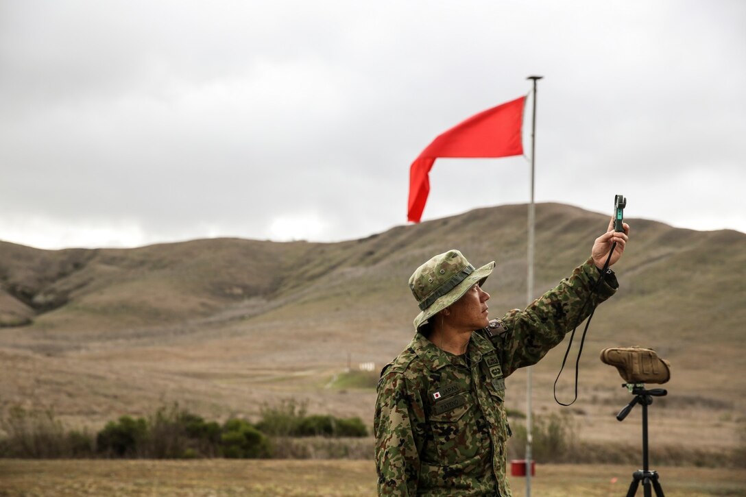 A soldier with the Japan Ground Self-Defense Force measures the wind value while conducting scout sniper training during Exercise Iron Fist 2014 aboard Camp Pendleton, Calif., Jan. 31, 2014. Iron Fist is an amphibious exercise that brings together Marines and sailors from the 15th Marine Expeditionary Unit, other I Marine Expeditionary Force units, and soldiers from the JGSDF, to promote military interoperability and hone individual and small-unit skills through challenging, complex and realistic training. (U.S. Marine Corps photo by Cpl. Emmanuel Ramos/Released)