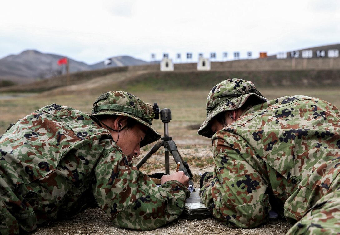 Soldiers with the Japan Ground Self-Defense Force log their shots from the 100 yard-line while conducting scout sniper training during Exercise Iron Fist 2014 aboard Camp Pendleton, Calif., Jan. 31, 2014. Iron Fist is an amphibious exercise that brings together Marines and sailors from the 15th Marine Expeditionary Unit, other I Marine Expeditionary Force units, and soldiers from the JGSDF, to promote military interoperability and hone individual and small-unit skills through challenging, complex and realistic training. (U.S. Marine Corps photo by Cpl. Emmanuel Ramos/Released) 