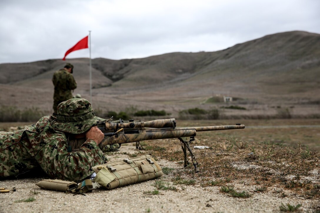 A soldier with the Japan Ground Self-Defense Force reloads after hitting his target from the 300 yard-line while conducting scout sniper training during Exercise Iron Fist 2014 aboard Camp Pendleton, Calif., Jan. 31, 2014. Iron Fist is an amphibious exercise that brings together Marines and sailors from the 15th Marine Expeditionary Unit, other I Marine Expeditionary Force units, and soldiers from the JGSDF, to promote military interoperability and hone individual and small-unit skills through challenging, complex and realistic training. (U.S. Marine Corps photo by Cpl. Emmanuel Ramos/Released)