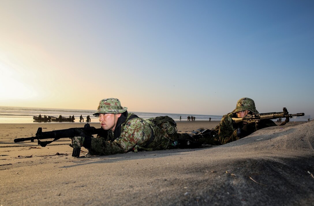 Soldiers with the Japan Ground Self-Defense Force provide security for the landing team during amphibious insertion training from the Expeditionary Warfare Training Group Pacific during Exercise Iron Fist 2014 aboard Naval Amphibious Base Coronado, Calif., Jan. 29, 2014. Iron Fist is an amphibious exercise that brings together Marines and sailors from the 15th Marine Expeditionary Unit, other I Marine Expeditionary Force units, and soldiers from the JGSDF, to promote military interoperability and hone individual and small-unit skills through challenging, complex and realistic training. (U.S. Marine Corps photo by Cpl. Emmanuel Ramos/Released)
