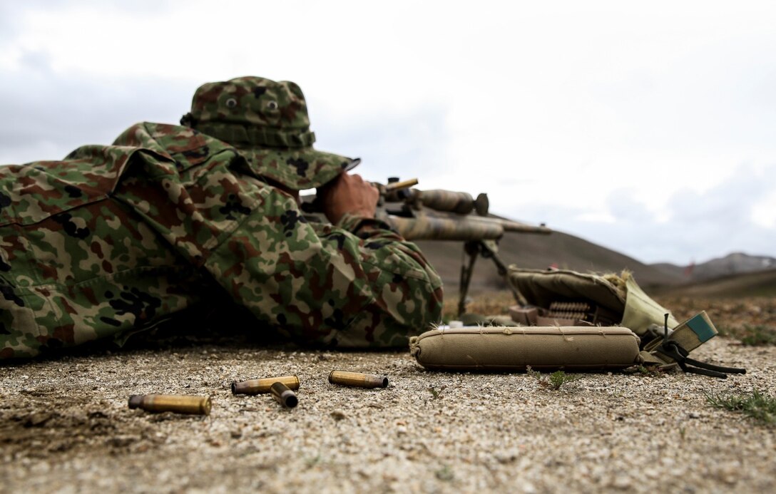 A soldier with the Japan Ground Self-Defense Force reloads after hitting his target from the 300 yard-line while conducting scout sniper training during Exercise Iron Fist 2014 aboard Camp Pendleton, Calif., Jan. 31, 2014. Iron Fist is an amphibious exercise that brings together Marines and sailors from the 15th Marine Expeditionary Unit, other I Marine Expeditionary Force units, and soldiers from the JGSDF, to promote military interoperability and hone individual and small-unit skills through challenging, complex and realistic training. (U.S. Marine Corps photo by Cpl. Emmanuel Ramos/Released)