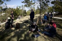 Navy Lt. Kevan Q. Lim tells the Marines and sailors how important Shuri Castle is to the local community members and the part it played in World War II Jan. 24 in Naha City. “It made me hopeful because we can go to a tourist area like today where Japanese, American and Okinawans citizens are wondering around probably one of the most fierce battle sites of World War II and yet today it’s a peaceful, beautiful area,” said Lim. Lim is the chaplain of Combat Logistics Regiment 37, 3rd Marine Logistics Group, III Marine Expeditionary Force