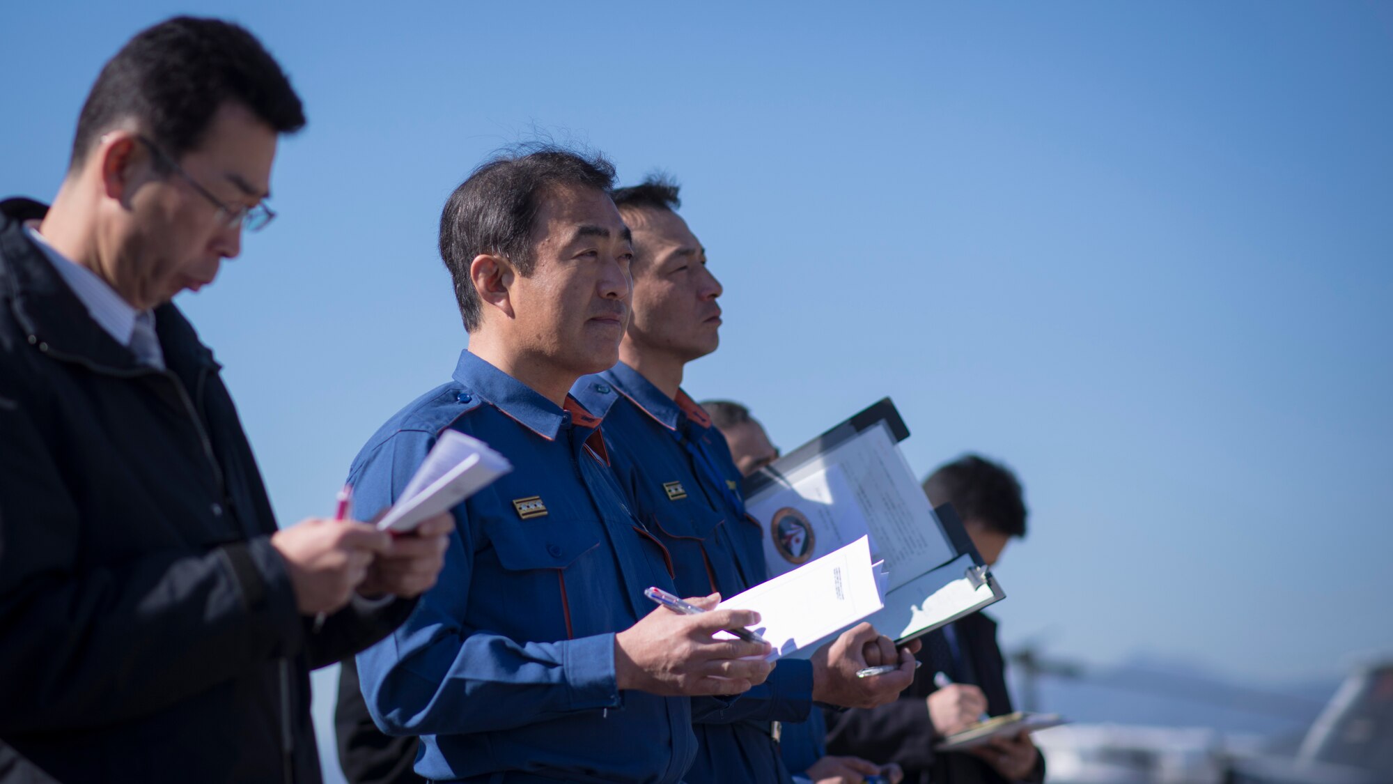 YOKOTA AIR BASE, Japan -- A Japanese first responder takes notes during a disaster preparedness exercise at Yokota Air Base, Japan, Jan. 31, 2014. The exercise was divided into a hands-on educational portion featuring Yokota’s aircraft and a tabletop portion that test U.S. and Japanese joint disaster response capability. (U.S. Air Force photo by Capt. Raymond Geoffroy/Released)