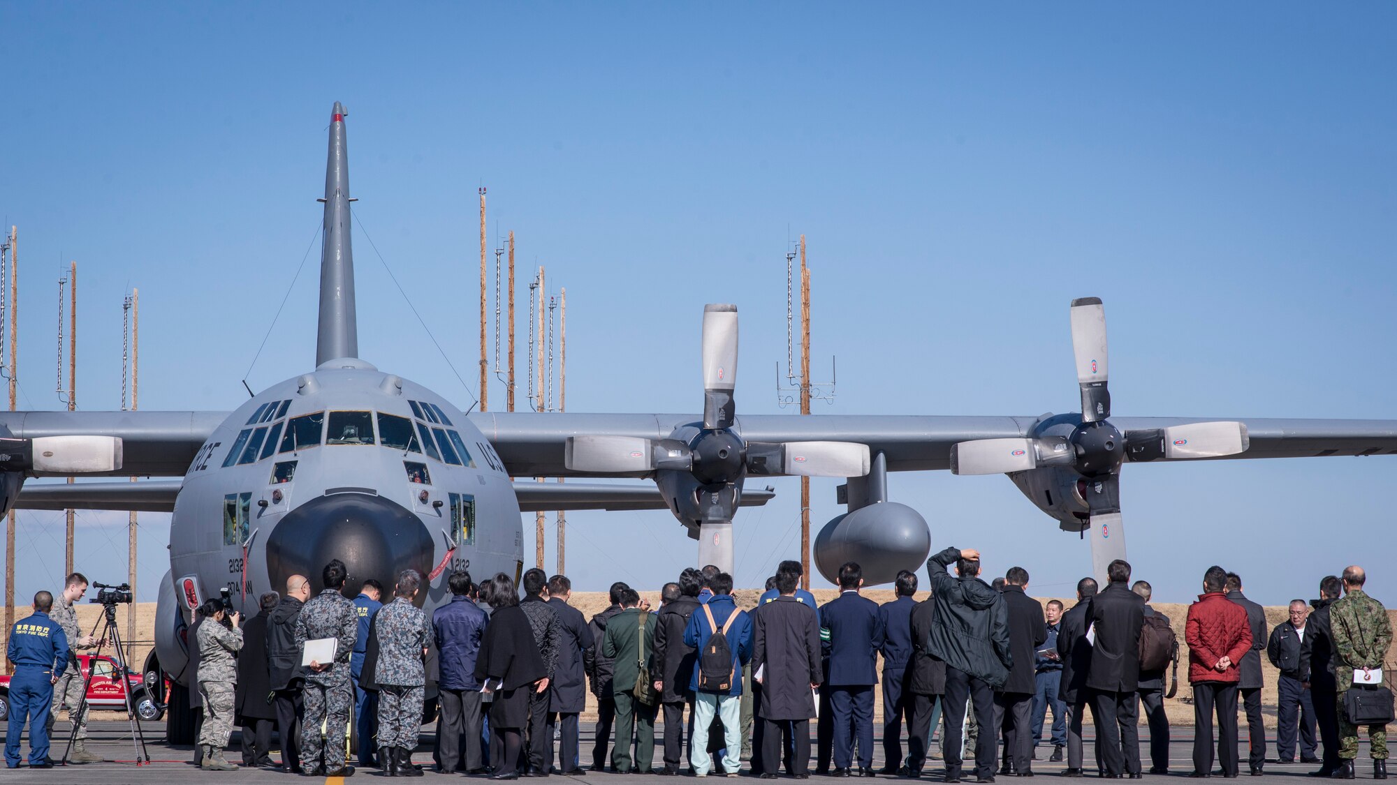 YOKOTA AIR BASE, Japan -- Japanese first responders learn about Yokota’s UH-1N Hueys during a disaster preparedness exercise at Yokota Air Base, Japan, Jan. 31, 2014. The exercise gave Japanese disaster response teams the opportunity to learn more about handling Yokota aircraft in the event of an emergency off-base. (U.S. Air Force photo by Capt. Raymond Geoffroy/Released)
