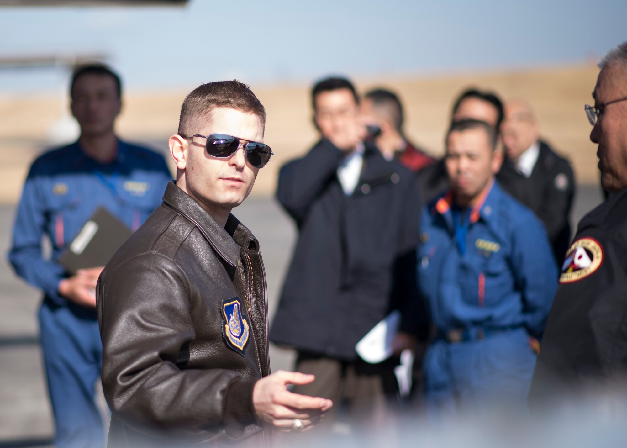 YOKOTA AIR BASE, Japan -- A pilot with the 459th Airlift Squadron briefs Japanese first responders on the C-12J Huron during a disaster preparedness exercise at Yokota Air Base, Japan, Jan. 31, 2014. The exercise gave Japanese disaster response teams the opportunity to learn more about handling Yokota aircraft in the event of an emergency off-base. (U.S. Air Force photo by Capt. Raymond Geoffroy/Released)
