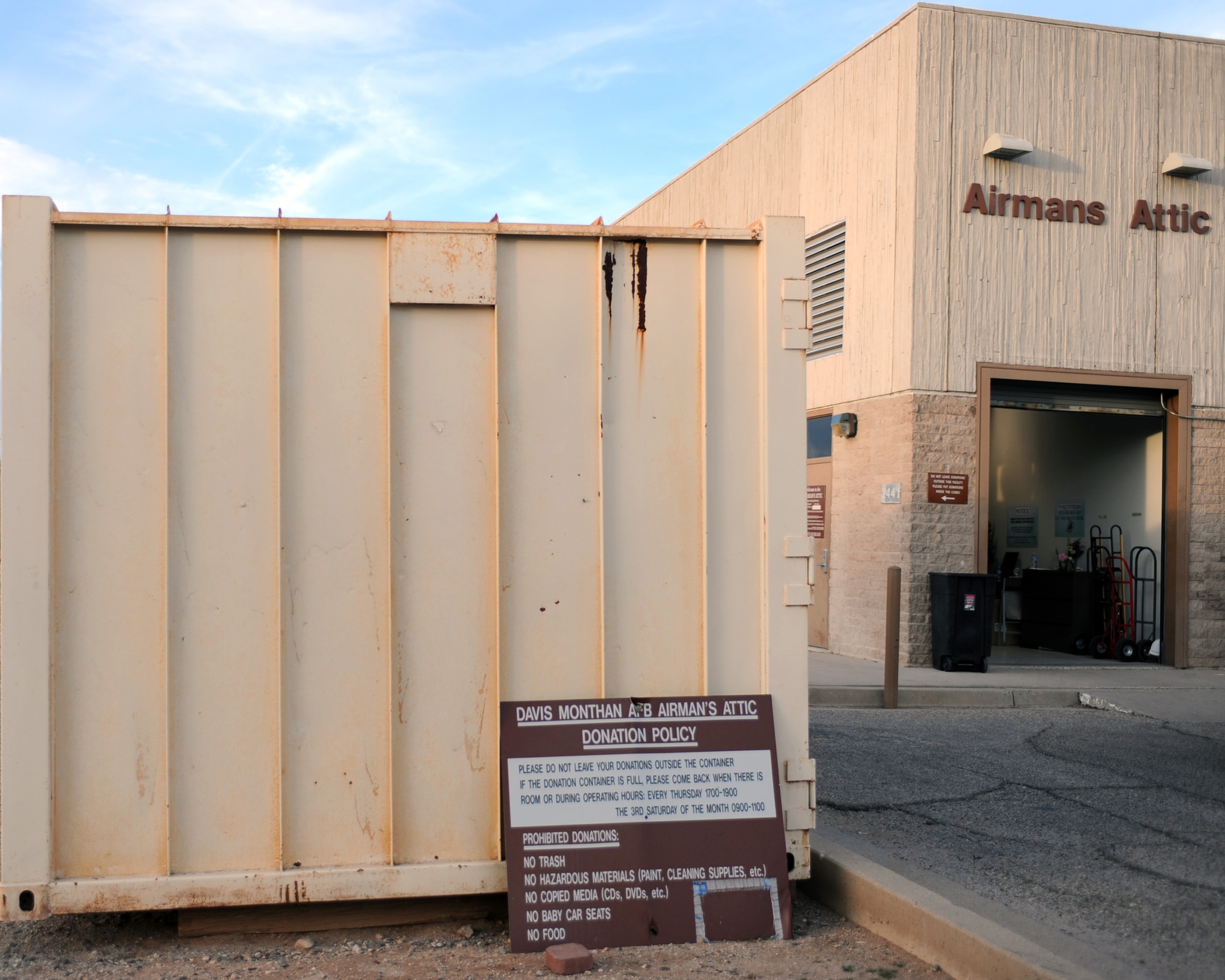 Two large, metal containers sit just outside the Airmans Attic at Davis-Monthan Air Force Base, Ariz., Jan. 30, 2014.  The containers are used to collect donations for the Attic and their contents are sorted by volunteers twice a week.  (U.S. Air Force photo by Airman 1st Class Chris Massey)