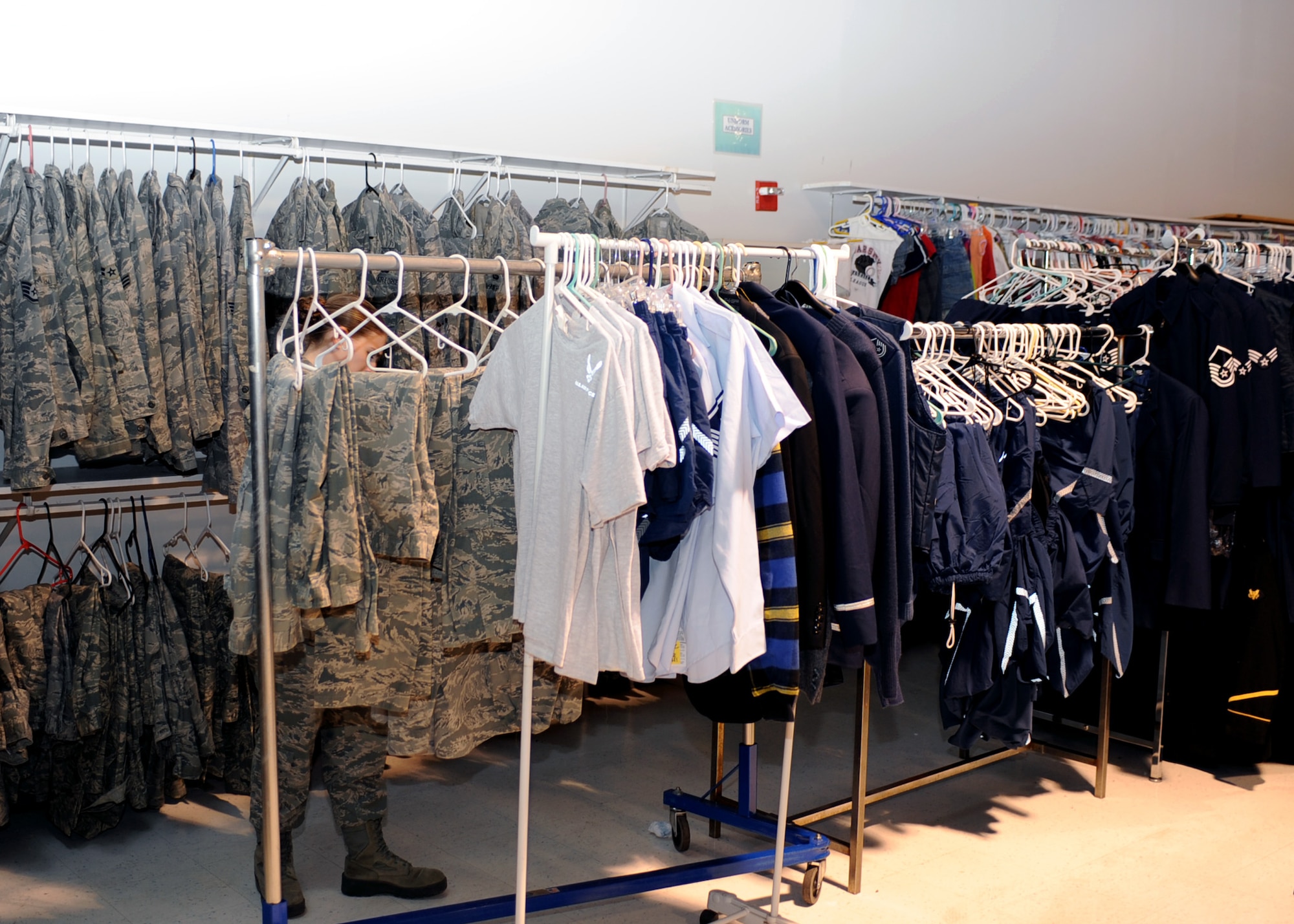 United States Air Force uniform items are displayed on clothing racks inside the Airmans Attic at Davis-Monthan Air Force Base, Ariz., Jan. 30, 2014.  The Attic receives donated uniform items and makes them available, free of charge, to Airmen of all ranks.  (U.S. Air Force photo by Airman 1st Class Chris Massey)