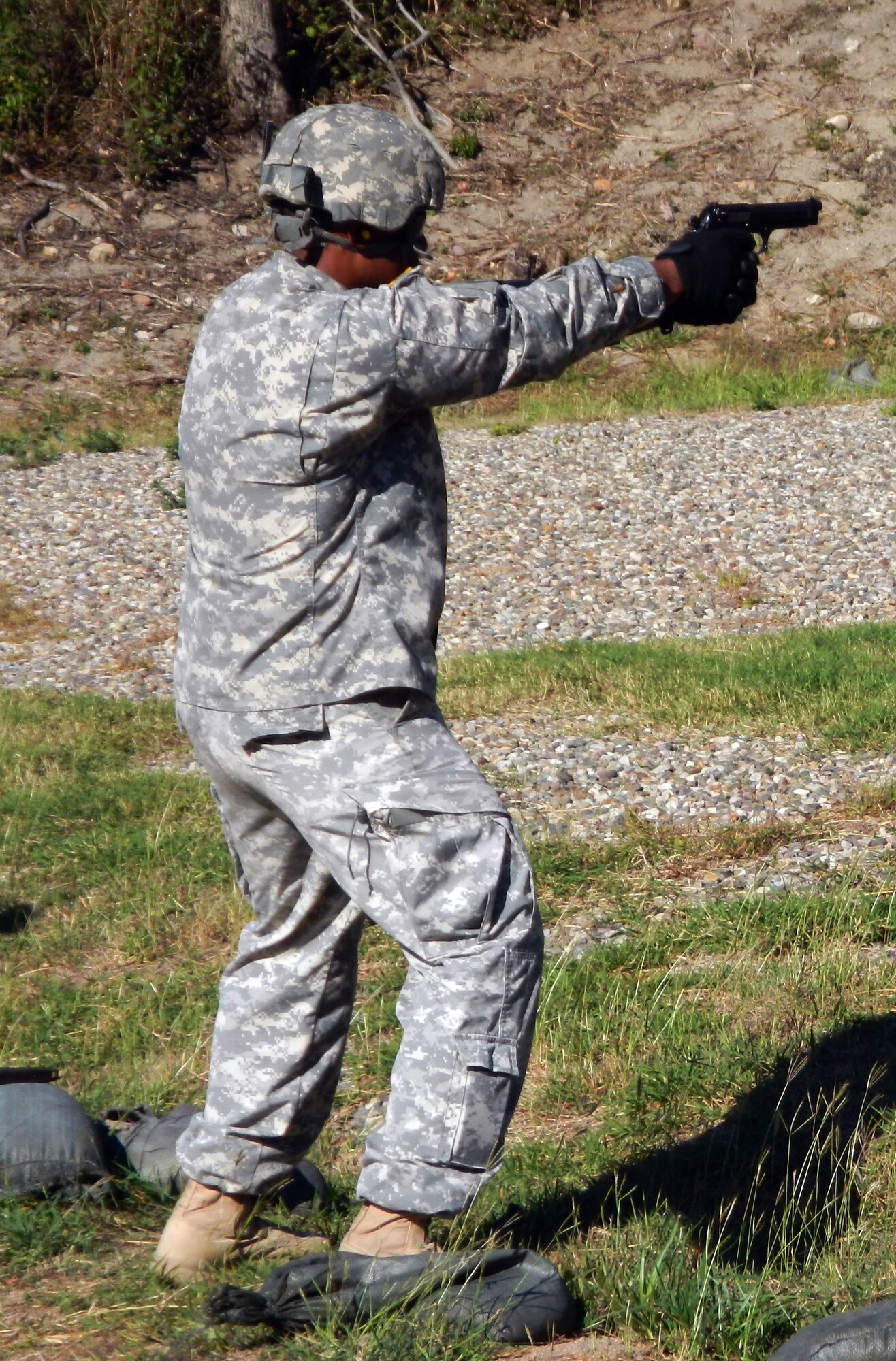 A member of Joint Task Force-Bravo's Army Forces Battalion fires an M9 pistol at the firing range at Soto Cano Air Base, Honduras, Jan. 29, 2013.  Members of ARFOR conducted small arms weapons training in order to maintain qualification requirements as well as proficiency on the weapons.  (Photo by U.S. Army Spc. Cory Cantlay)  