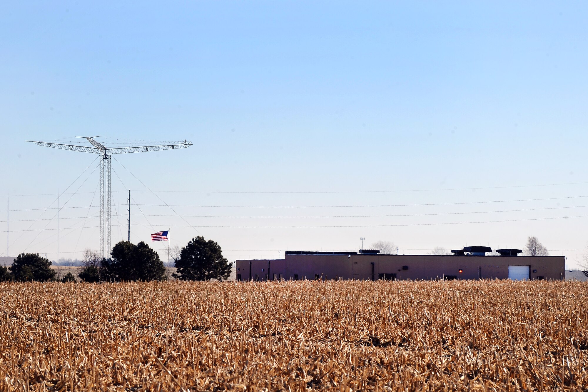 Surrounded by towering antennas, building 200, the headquarters for the High Frequency Global Network, sits in the middle of a cornfield just North of Elkhorn, Neb.  The facility is one of 13 sites worldwide that make up the HFGN.  (U.S. Air Force photo by Josh Plueger/Released)