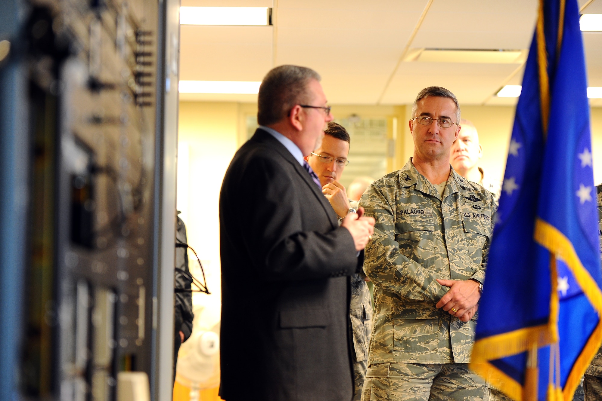 Dave Clingerman, a telecommunications specialist with the 55th Strategic Communications Squadron, briefs U.S. Air Force Col. Hans Palaoro, 55th Wing vice commander, along with members of the 55th Communications Group leadership on the mission and equipment used at the High Frequency Global Communication System Jan. 29, Elkhorn, Neb.  The annex is located 30 miles northwest of Offutt Air Force Base.  (U.S. Air Force photo by Josh Plueger/Released)