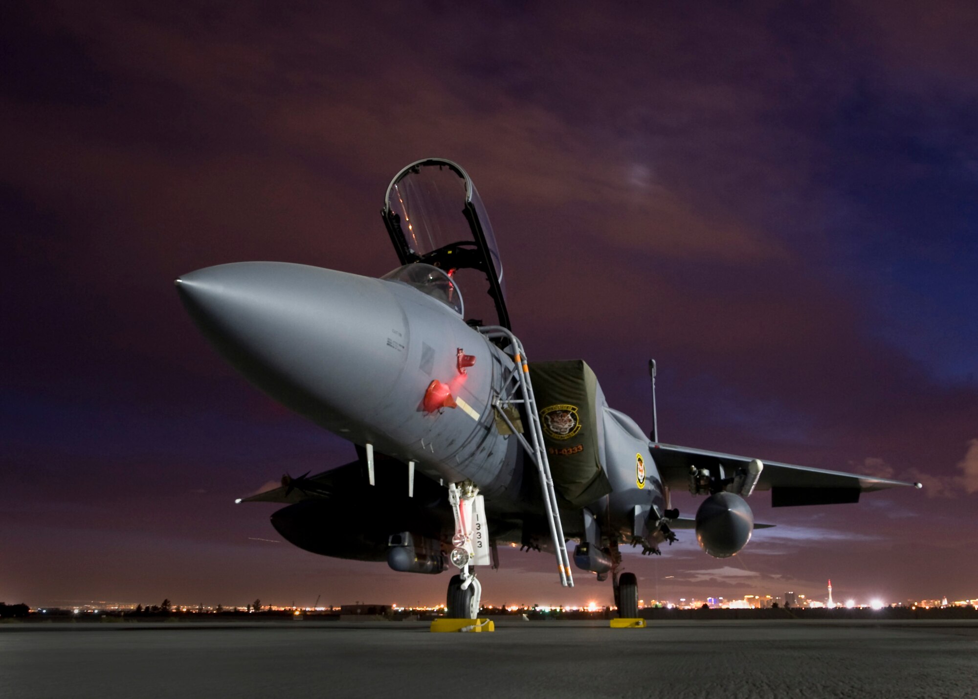 An F-15E Strike Eagle assigned to Mountain Home Air Force Base, Idaho, awaits pre-flight checks during Red Flag 14-1 Jan. 31, 2014, at Nellis AFB, Nev. Red Flag gives Airmen an opportunity to experience realistic, stressful combat situations in a controlled environment to increase their ability to complete missions and safely return home.  (U.S. Air Force photo by Airman 1st Class Jason Couillard)