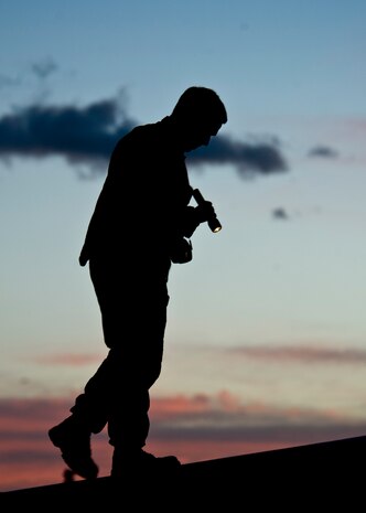 Leading Aircraftman Randall Costello, No. 77 Squadron armament technician, from Royal Australian Air Force Base Williamtown, Australia, conducts a pre-flight inspection during Red Flag 14-1, Jan. 31, 2014, at Nellis Air Force Base, Nev. Red Flag gives aircrews and air support operations service members from various airframes, military services, and allied countries an opportunity to integrate and practice combat operations.  (U.S. Air Force photo by Airman 1st Class Jason Couillard)
