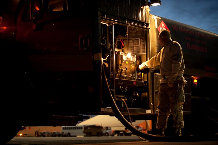 Senior Airman Justin Tate, a 4th Logistics Readiness Squadron fuels distribution operator, from Seymour Johnson Air Force Base, N.C., refuels aircraft prior to a night training during Red Flag 14-1 at Nellis AFB, Nev., Jan. 30, 2014. Fuels distribution operators are responsible for the refueling approximately 125 U.S. and coalition aircraft for multiple missions per day during Red Flag. (U.S. Air Force photo by Airman 1st Class Joshua Kleinholz)