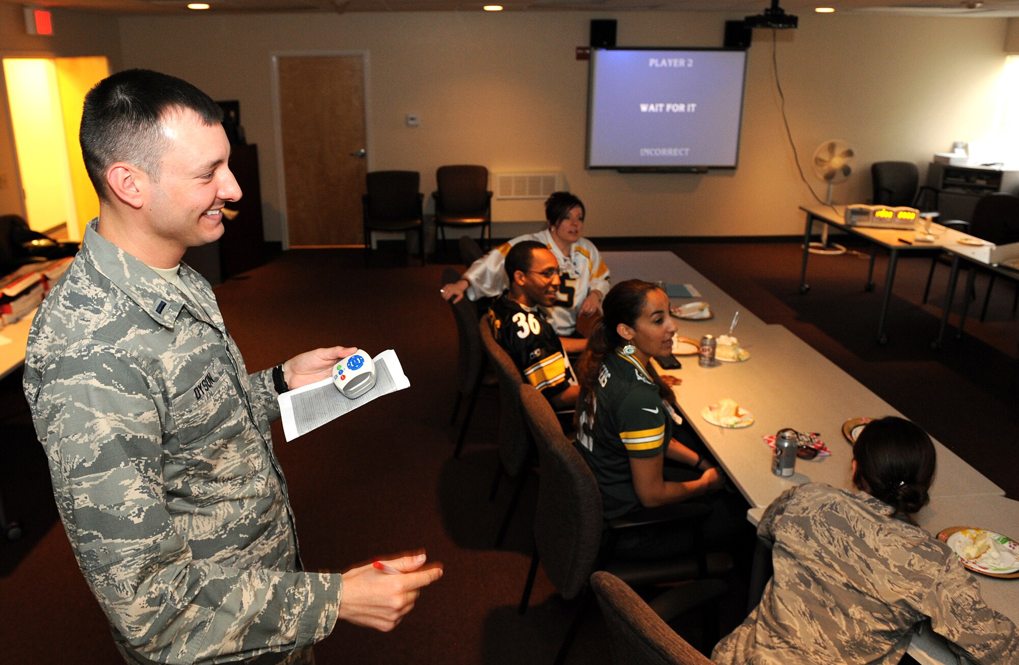 1st Lt. Sean Dyson 355th Aerospace Medicine Squadron bioenvironmental engineer, hosts a game of Jeopardy for staff members of the Biomedical Sciences Corps during the BSC appreciation week at Davis-Monthan Air Force Base, Ariz., Jan. 31, 2014. During the BSC appreciation week where select staff members shadowed different Air Force Specialty Codes to acquire a better understanding of each other's occupational responsibilities. (U.S. Air Force photo Airman 1st Class Chris Drzazgowski/Released)