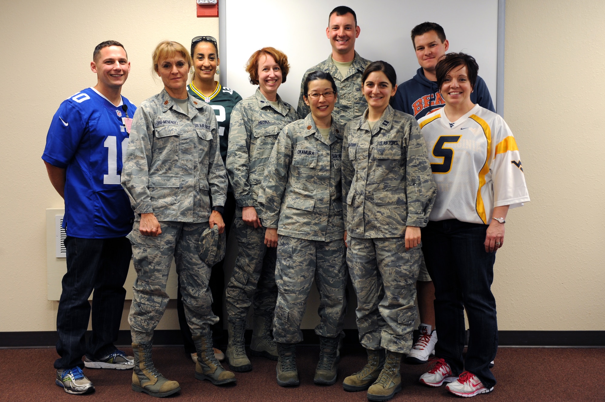 Biomedical Sciences Corps staff members pose for a group photo after a luncheon at Davis-Monthan Air Force Base, Ariz., Jan. 31, 2014. Ten of the 15 Biomedical Science Corps practiced among the U.S. Air Force are represented at D-M to include pharmacy, bioenvironmental engineering and public health. (U.S. Air Force photo by Airman 1st Class Chris Drzazgowski)