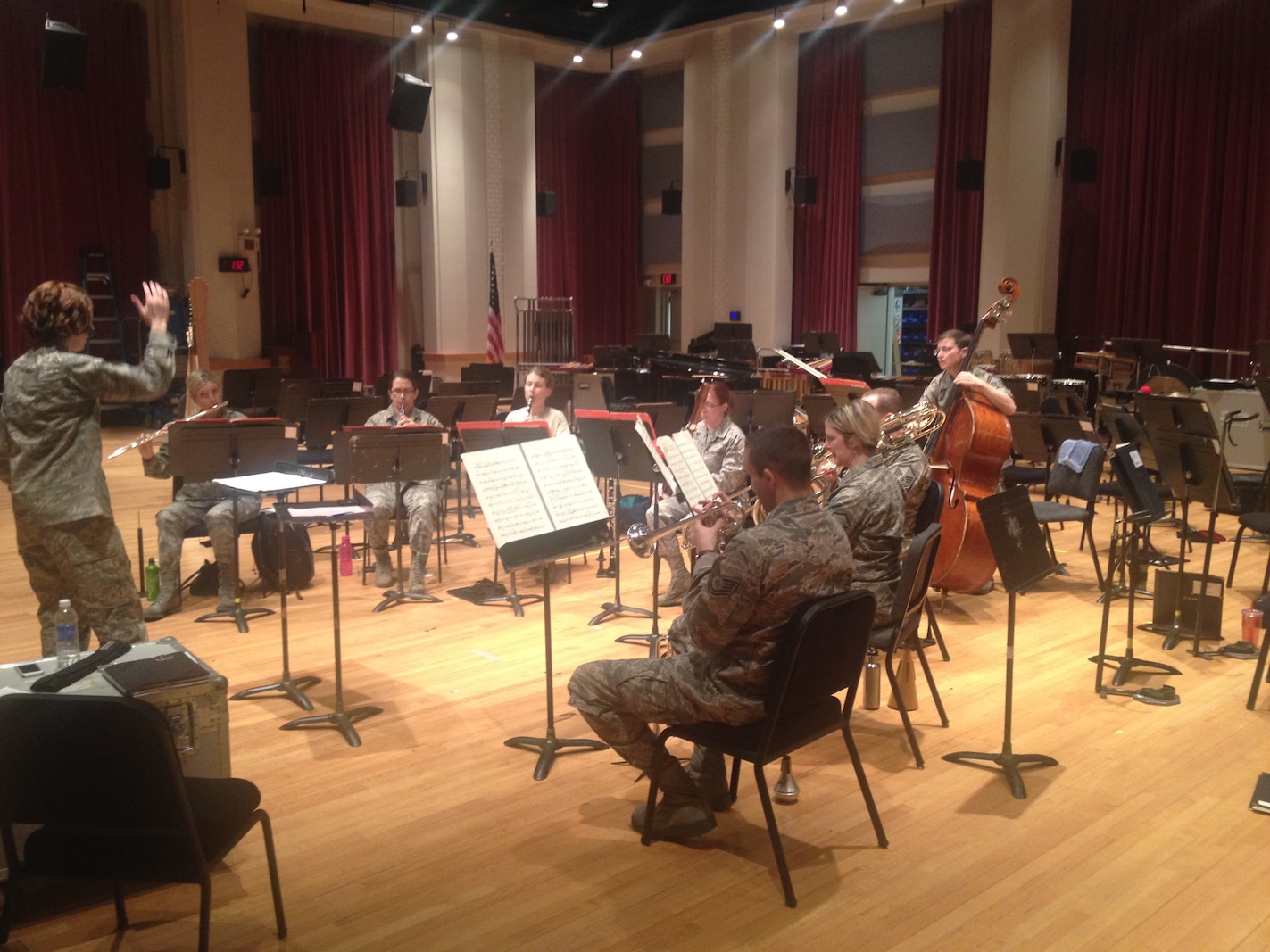 Airmen musicians, conducted by 1st Lt. Shanti Nolan, rehearse for a chamber
recital celebrating the 'Year of the Military Woman.' (A.F. photo
released/Master Sgt. Jake McCray)
