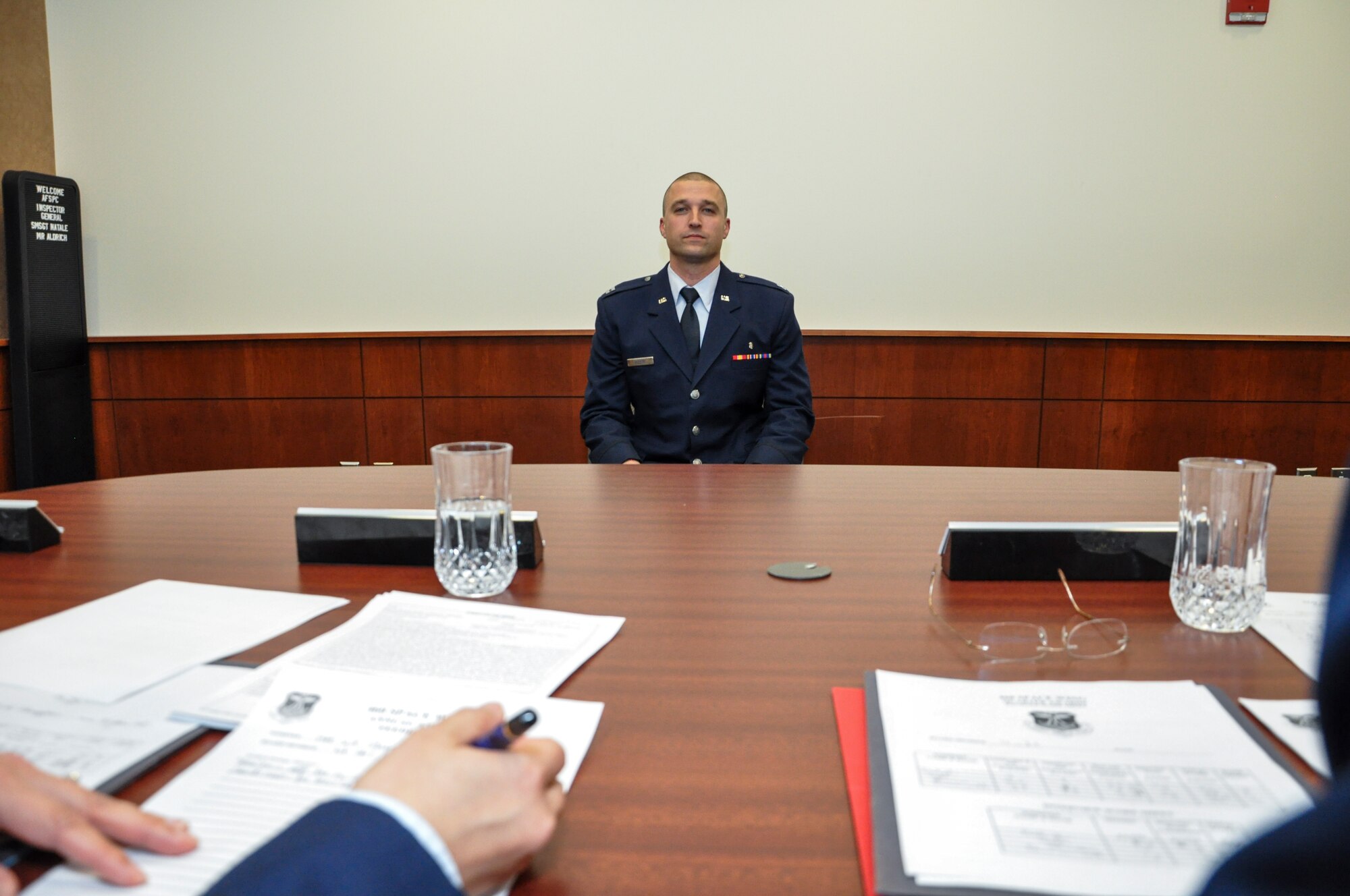 Capt. John Doleski, 460th Medical Group company grade officer category annual award nominee, sits before a mock annual awards board panel Jan. 27, 2014, at the 460th Space Wing headquarters building on Buckley Air Force Base, Colo. All competitors met the annual awards board as part of their overall submission packages. (U.S. Air Force photo by Staff Sgt. Nicholas Rau/Released)