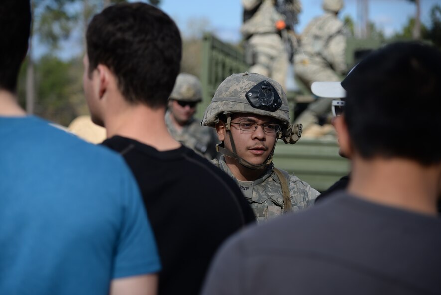 U.S. Air Force Senior Airman Sean Soria, 822nd Base Defense Squadron fireteam member, speaks with angry protesters during the EXERCISE SAFESIDE GUARDIAN, Jan. 27, 2014, at Moody Air Force Base, Ga. Soria’s objective was to deescalate the situation while using the least amount of force possible.  (U.S. Air Force photo by Airman 1st Class Sandra Marrero/Released)