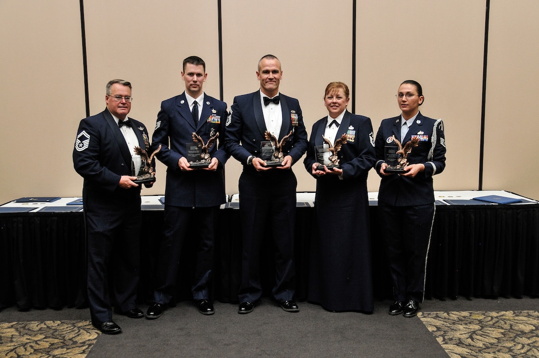 Members of the Utah Air National Guard received their Airmen of the Year awards for 2013. The awards ceremony was held on January 17, 2014 at Hill AFB. Recipients are, from the left, Airman of the Year Senior Master Sgt. Jeffory Mulcahy for Senior Airman John Webb of the 169th Intelligence Squadron, NCO of the year Staff Sgt. Tyson Mayfield of the 151st Security Forces Squadron, Senior NCO of the year Senior Master Sgt. Wayne Ormond from Utah State Headquarters, First Sergeant of the Year Master Sgt. Joan Cornell of the 169th Intelligence Squadron and Honor Guard member of the year Tech. Sgt. Jada Slayton. (U.S. Air National Guard photo by Tech. Sgt. Jeremy Giacoletto-Stegall)(RELEASED)