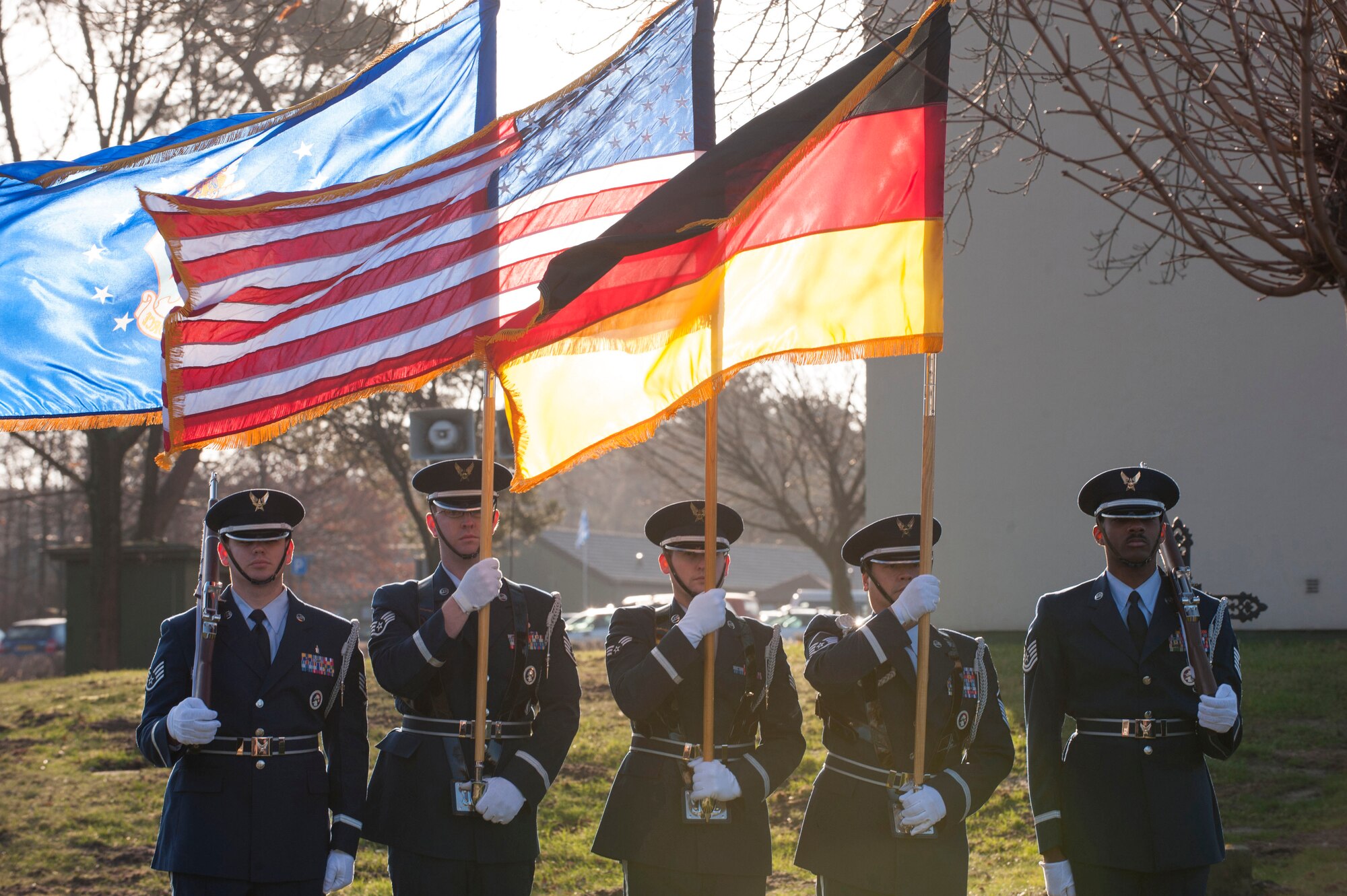 Air Force honor guard members perform color guard duties at the memorial for the crew of "ESSO 77" in  Geilenkirchen, Germany, Jan. 10, 2014.  The memorial pays tribute to four 141st ARW who lost their lives in a KC-135E Stratotanker crash on Jan. 13, 1999. (U.S. Air Force photo by Mr André Joosten/Released)