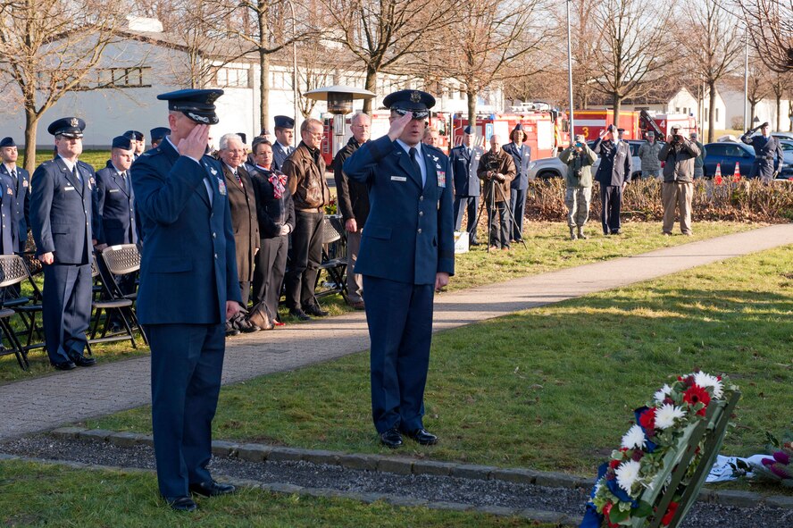 Maj. Gen. Andrew M. Mueller, Commander NATO E-3A Component, Geilenkirchen, Germany and Col. Daniel J Swain, Commander 141st Air Refueling Wing, Fairchild AFB, WA, render a final salute to the Crew of "ESSO 77" during a 15 year mermorial ceremony, Geilenkirchen, Germany, Jan. 10, 2014. The memorial pays tribute to four 141st ARW who lost their lives in a KC-135E Stratotanker crash on Jan. 13, 1999. (NATO E-3 component photo by Mr André Joosten/Released) 

