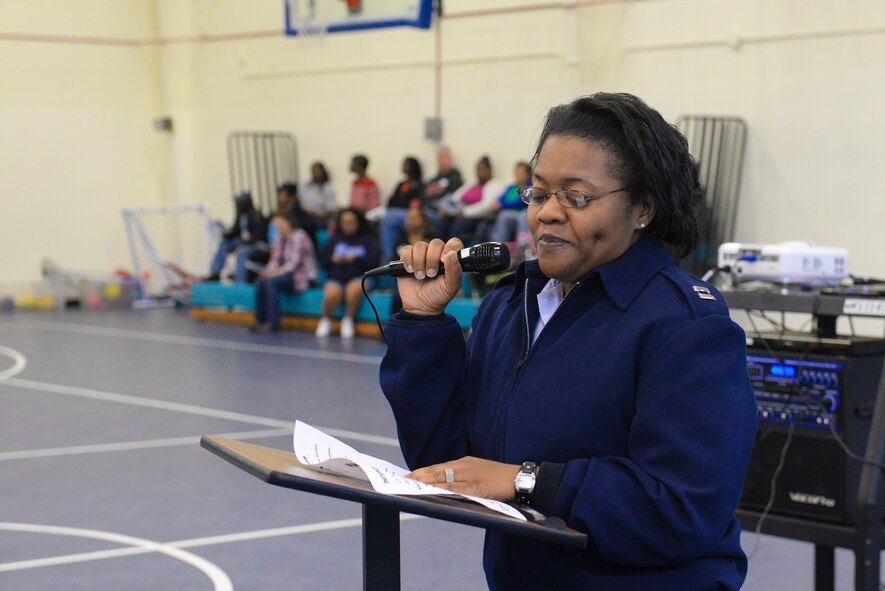 U.S. Air Force Capt. Amanda Sims-High, 23d Medical Operations Squadron officer in charge, welcomes guests to the “Preparing Teens for the Real World” event at Moody Air Force Base, Ga., Feb. 1, 2014. During the event, teens had a chance to participate in an open mic session and a talent show. (U.S. Air Force photo by Senior Airman Olivia Bumpers/Released)