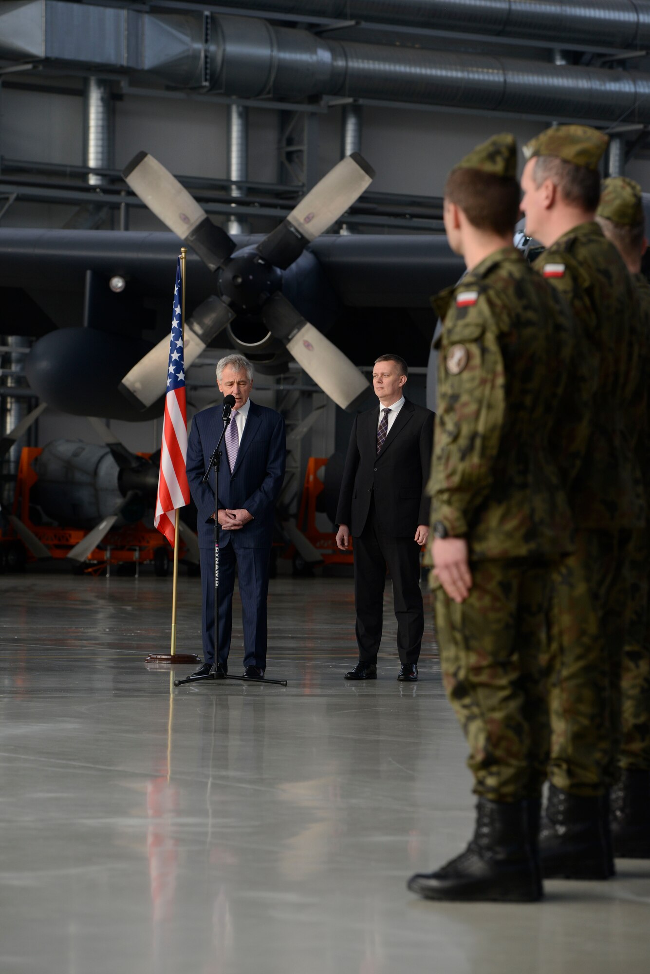 U.S. Secretary of Defense Chuck Hagel speaks to Polish and U.S. Airmen at Powidz Air Base, Poland Jan. 31, 2014, on the importance of partnership and building friendships. The Av-Det  mission enhances U.S. bilateral defense ties and demonstrates its enduring partnership with Poland. (U.S. Air Force photo by Staff Sgt. Christopher Ruano)