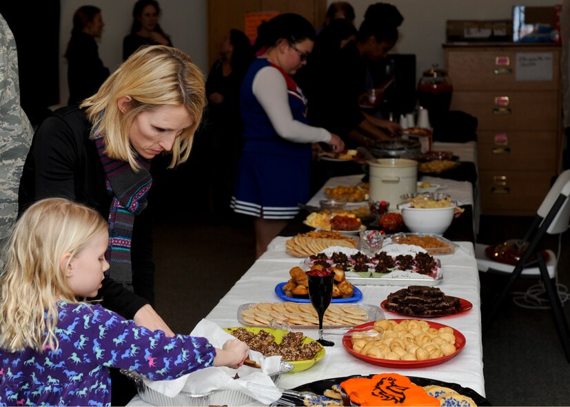 Patrons were welcomed to food and beverages during the B-One Yard Thrift Store Volunteer Appreciation Dinner and Fashion Show in the Chapel Activities Center at Ellsworth Air Force Base, S.D., Jan. 28, 2014. In addition to the fashion show, attendees were able to participate in raffle prizes and purchase auction baskets to help raise funds for the continued operation of the B-One Yard Thrift Store. (U.S. Air Force photo by Senior Airman Anania Tekurio/Released) 