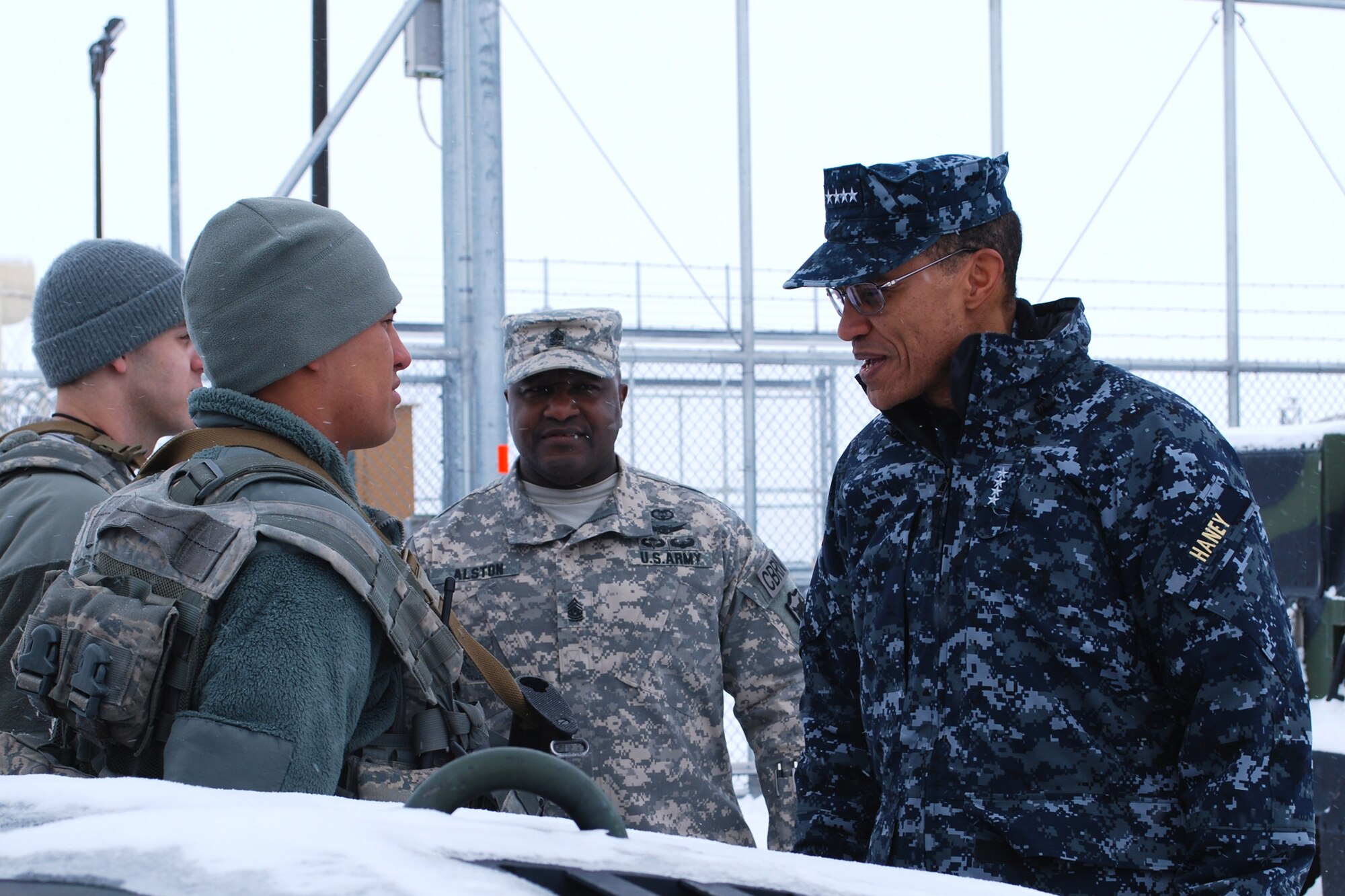 Adm. Cecil D. Haney, U.S. Strategic Command commander, listens to Airman Jacob Yates, 341st Security Forces Squadron member, give a post brief at the Weapons Storage Area at Malmstrom Air Force Base on Jan. 30. Haney met a variety of Airmen, including maintainers, missileers and chefs, who support the nation’s nuclear deterrence and assurance mission. (U.S. Air Force photo/Senior Airman Katrina Heikkinen)