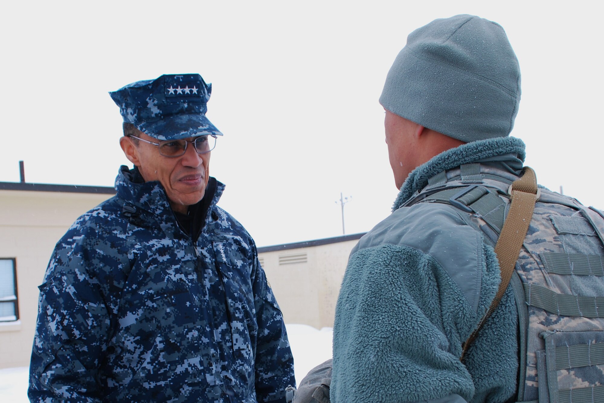 Adm. Cecil D. Haney, U.S. Strategic Command commander, listens to Airman Jacob Yates, 341st Security Forces Squadron member, give a post brief at the Weapons Storage Area at Malmstrom Air Force Base, on Jan. 30. Haney met a variety of Airmen, including maintainers, missileers and chefs, who support the nation’s nuclear deterrence and assurance mission. This trip is part of his larger initiative to visit all contributors to the nation’s nuclear mission in the first year of command. (U.S. Air Force photo/Senior Airman Katrina Heikkinen)