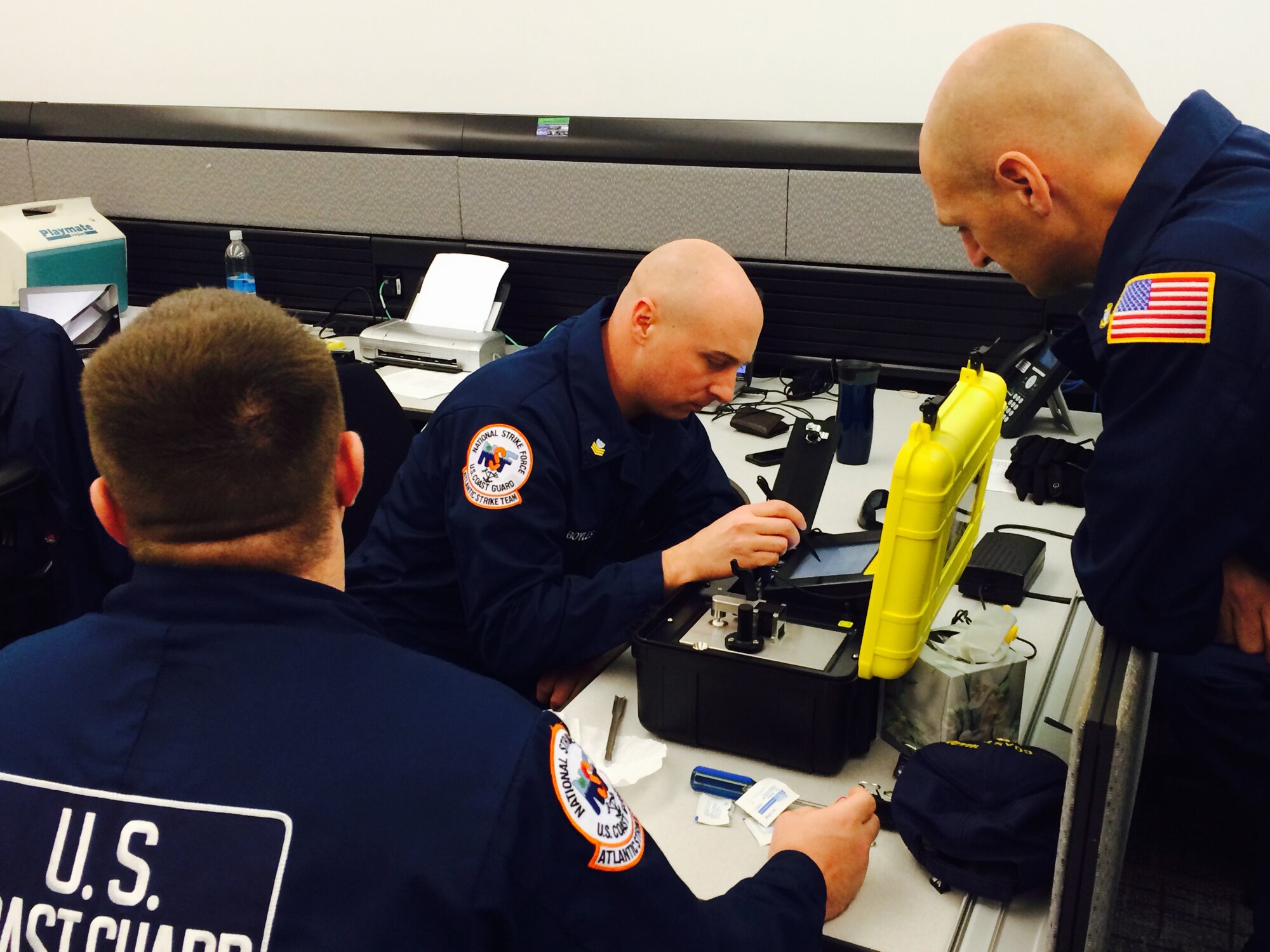 Coast Guard Petty Officer 1st Class Aki Boyles and Coast Guard Chief Petty Officer David Bartolini, both Atlantic Strike Team members, conduct training on hazardous-material equipment prior to assisting with security operations at Super Bowl XLVIII Jan. 30, 2014, in East Rutherford, N.J.