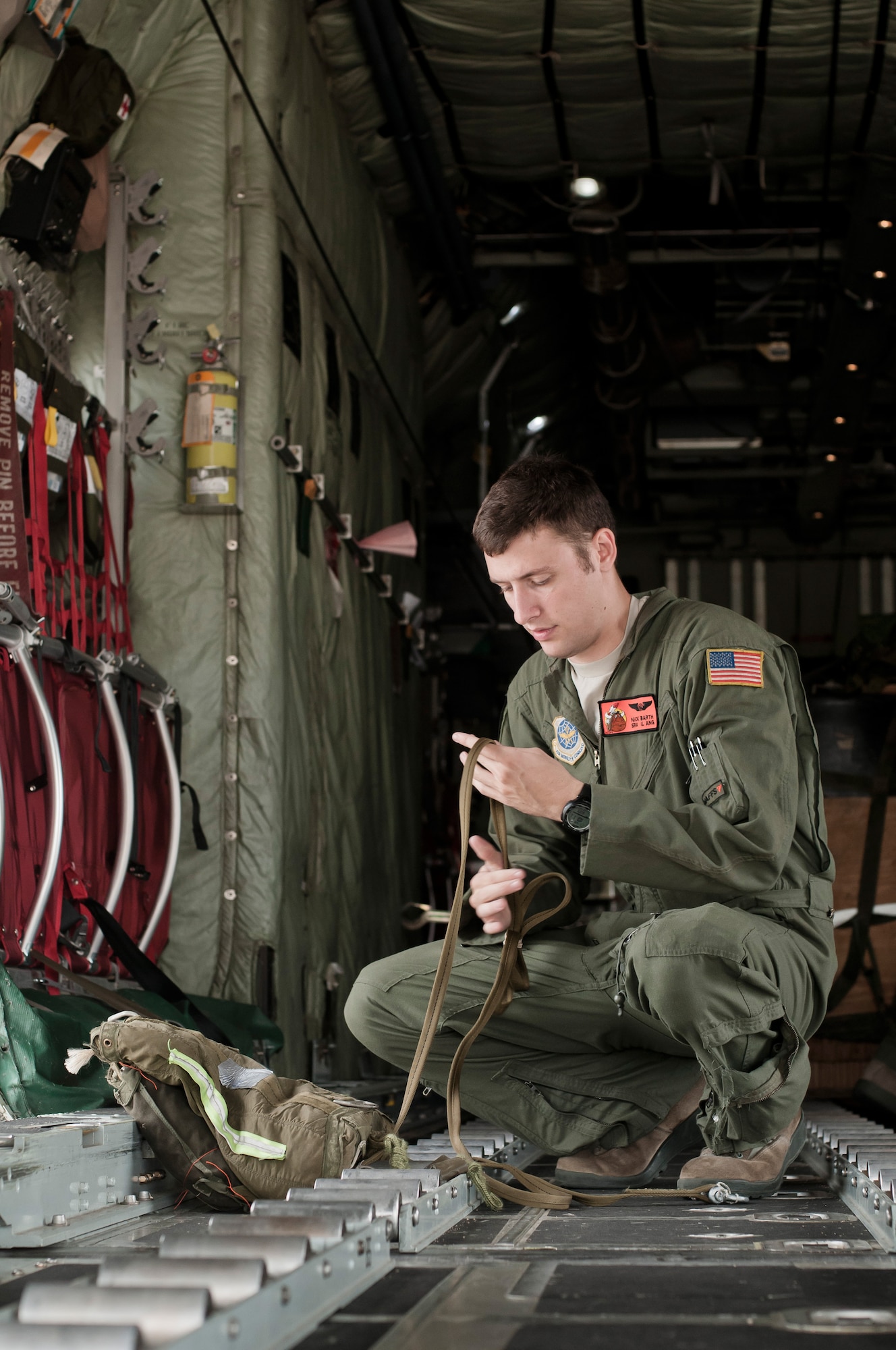 U.S. Air Force Senior Airman Nick J. Barth, an aircraft loadmaster with the 169th Airlift Squadron, packs a training bundle on a C-130 Hercules at Alpena, Mich., in support of Exercise Northern Strike 2013 on Aug. 7, 2013. Exercise Northern Strike 2013 is a joint multi-national combined arms training exercise conducted in northern Michigan. (U.S. Air National Guard photo by Master Sgt. Scott Thompson/released)