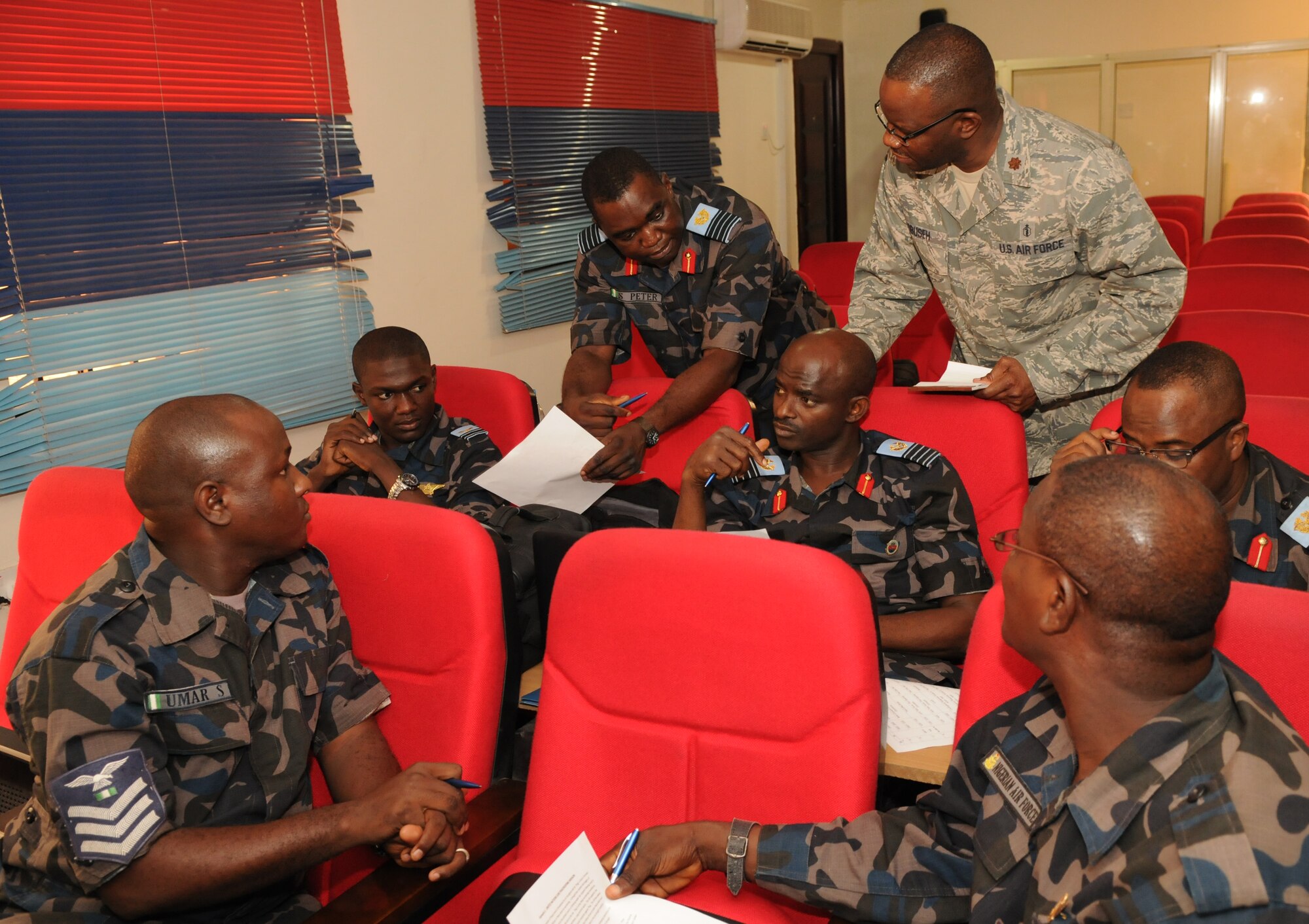 ABUJA, Nigeria – Maj. Francis Obuseh, U.S. Air Forces in Europe-Air Forces Africa Surgeon General directorate, doctor of public health, discusses medical considerations with members of the Nigerian air force as they develop plans for a disaster relief scenario. The Nigerian air force hosted a seminar in partnership with USAFE-AFAFRICA, the 621st Contingency Response Wing, and U.S. Africa Command to discuss contingency response planning and capabilities at the National Defense College in Abuja, Nigeria, Jan 27-30.  (Photo by U.S. Air Force Capt. Sybil Taunton/Released)