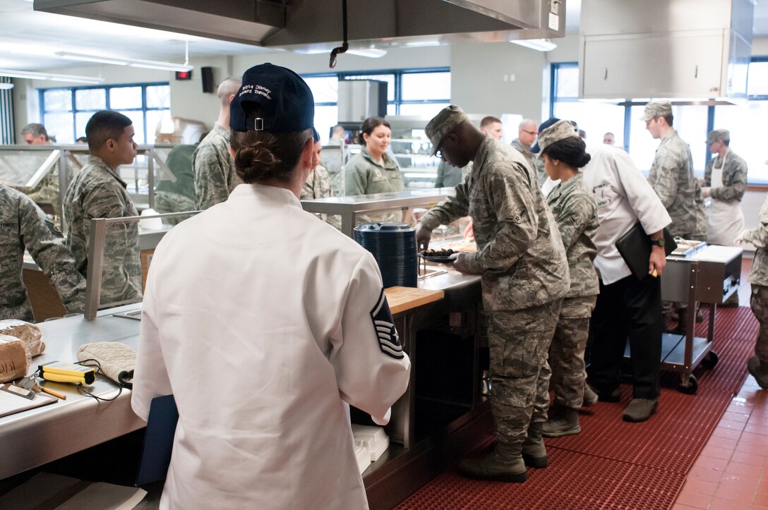 Evaluators from the Kenneth Disney Award examine the 182d Services Flight during a lunch service at the 182nd Airlift Wing, Peoria, Ill. on Feb. 1, 2014. The Services Flight was one of three units being evaluated for the award. (U.S. Air National Guard photo by Master Sgt. Scott Thompson (released))