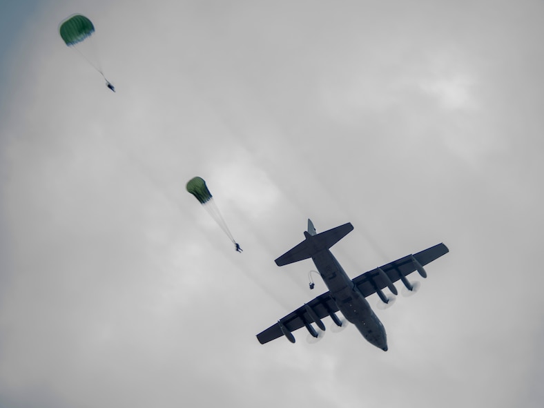 Airmen from the 822nd Base Defense Squadron conduct static-line jumps out of an HC-130P Combat King from the 71st Rescue Squadron Jan. 24, 2014, at Moody Air Force Base, Ga. The jumps kicked off EXERCISE SAFESIDE GUARDIAN which was designed to validate the unit’s ability to conduct offensive and defensive ground combat operations in a deployed location. (U.S. Air Force photo by Staff Sgt. Jamal D. Sutter/Released)