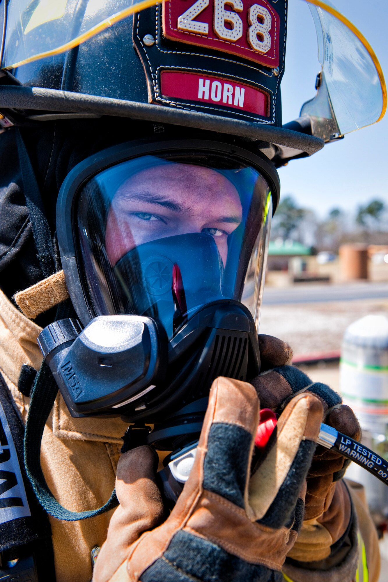 Portrait-Personality Photograph, 3rd Place

U.S. Army Spc. Matthew Horn, a firefighter with the 268th Engineer Detachment, South Carolina National Guard attaches the regulator/breathing tube to his mask at the South Carolina Fire Academy in Columbia, S.C., March 29, 2013. Firefighters of the 264th, 265th, 266th, 267th and 268th Engineer Detachments are performing their two-week annual training at the academy as part of their unit validation. (U.S. Air National Guard photo by Tech. Sgt. Jorge Intriago/Released)