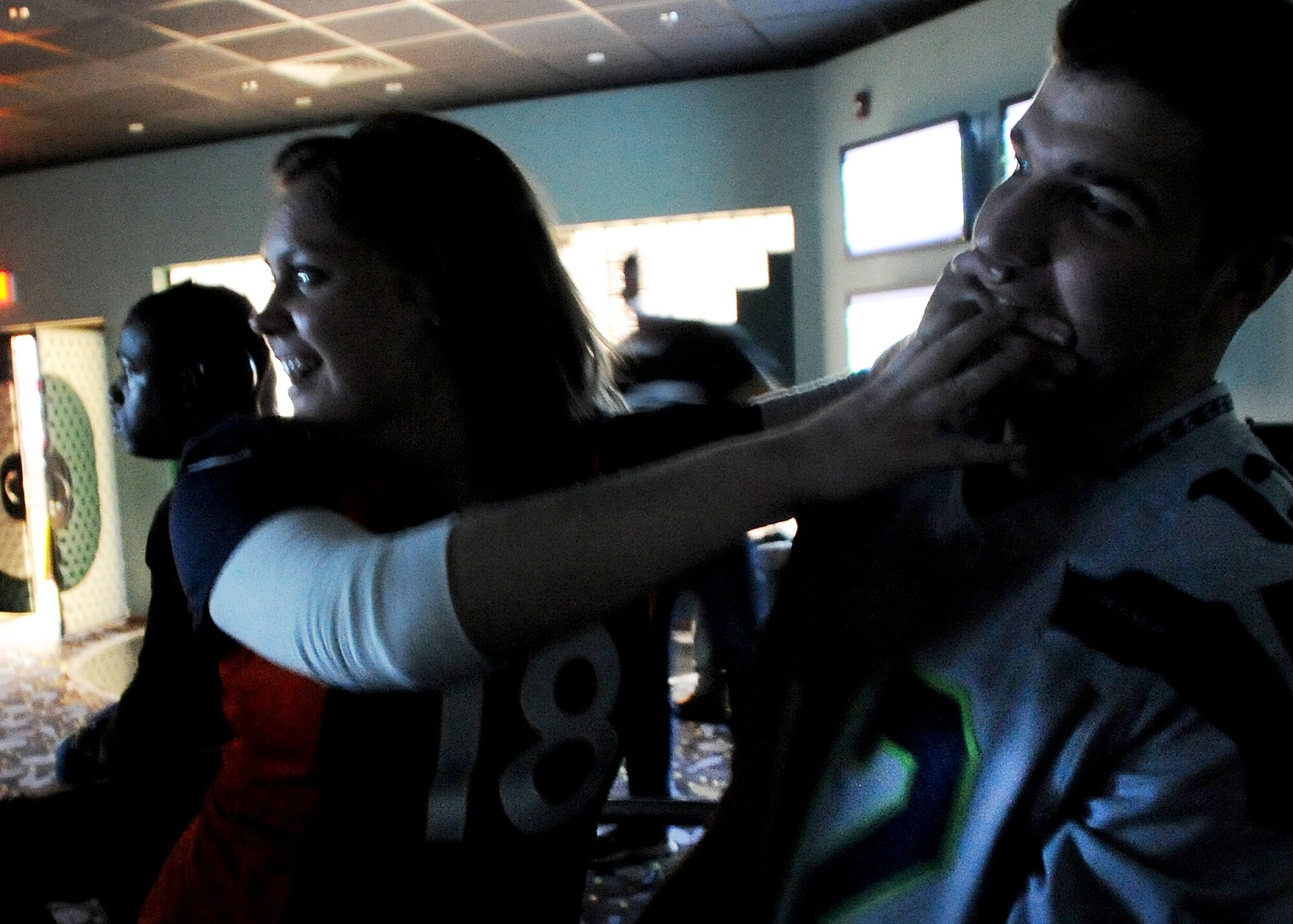 INCIRLIK AIR BASE, Turkey – Airman 1st Class Krystal Day and Airman 1st Class Fernando Bernal, 39th Security Forces Squadron, debate over opposing teams during Super Bowl 48, Feb. 3, here. The Big City bowling center and Incirlik Club Complex held Super Bowl parties with live broadcast of the programing for the Incirlik community with a local start time of 1:30 a.m. (U.S. Air Force photo by Staff Sgt. Veronica Pierce/Released)  