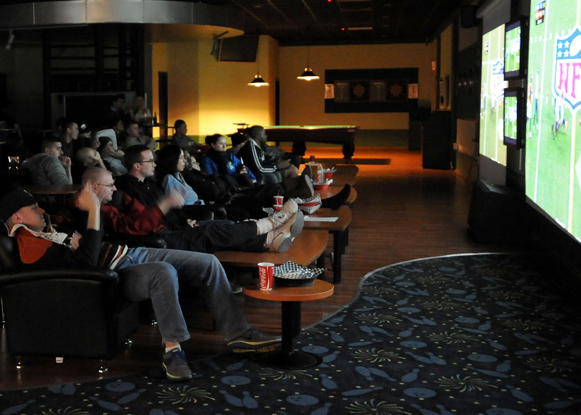 INCIRLIK AIR BASE, Turkey -- Football fans gaze at the multi-screen set up in the After Six lounge during Super Bowl 48, Feb. 3, here. The Big City bowling center and Incirlik Club Complex held Super Bowl parties with live broadcast of the program for the Incirlik community with a local start time of 1:30 a.m. (U.S. Air Force photo by Staff Sgt. Veronica Pierce/Released)  