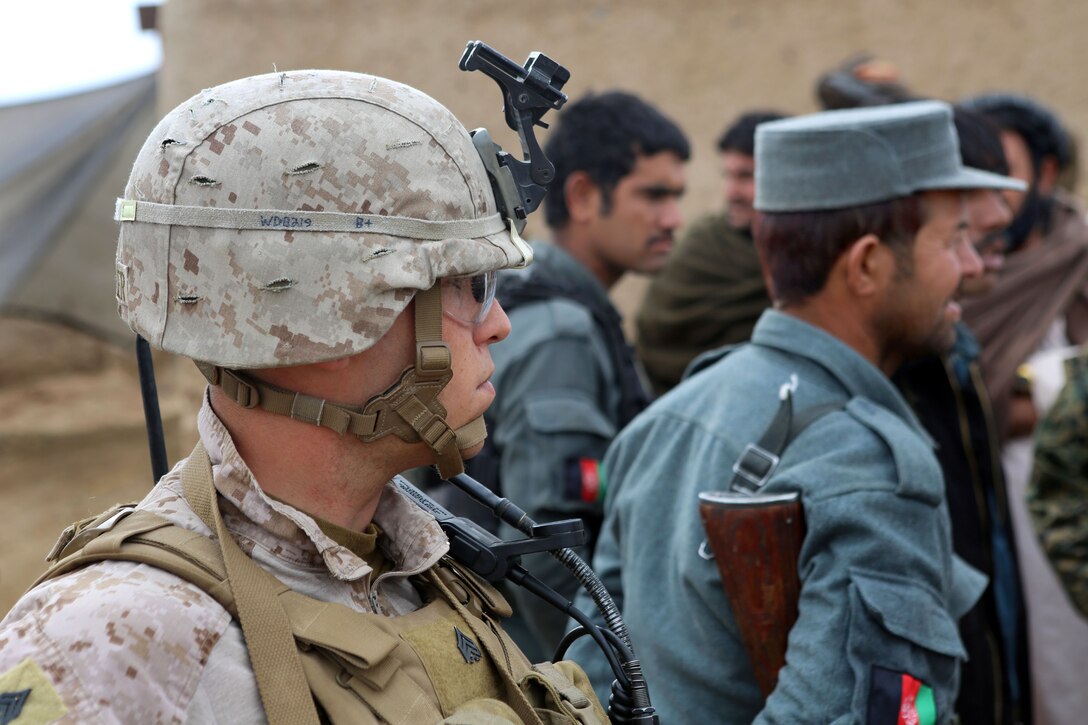 U.S. Marine Corps Sgt. Jacob Dofner, foreground, and fellow Marines conduct a joint patrol with Afghan local police outside Camp Dwyer in Helmand province, Afghanistan, Jan. 21, 2014. Dofner is assigned to Weapons Company, 1st Battalion, 9th Marine Regiment. 