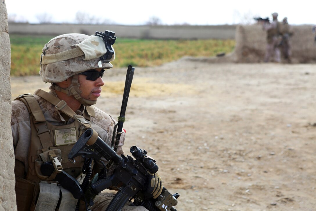 U.S. Marine Corps Cpl. Jerome Christian provides security during a joint patrol with Afghan local police outside Camp Dwyer in Helmand province, Afghanistan, Jan. 21, 2014. Christian is assigned to Weapons Company, 1st Battalion, 9th Marine Regiment.