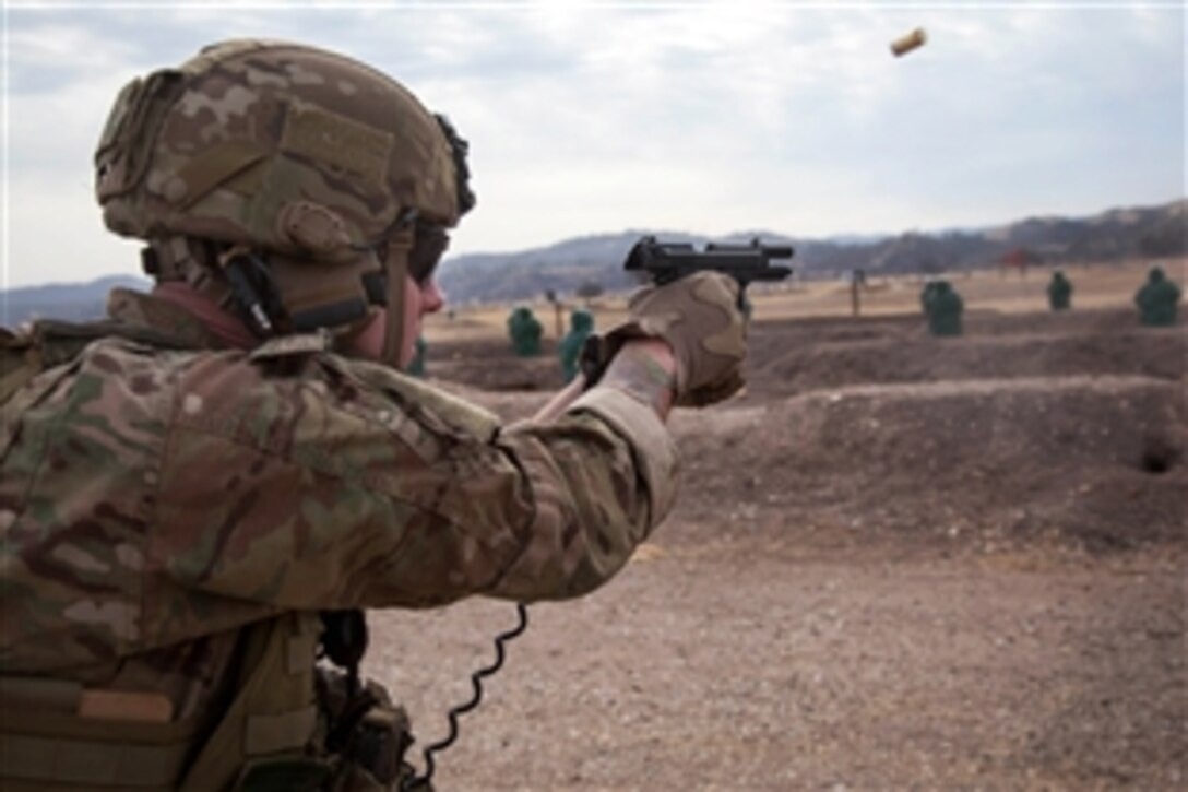 An Army Ranger fires the last round in his M9 9mm pistol at a range on Fort Hunter Liggett, Calif., Jan. 24, 2014.