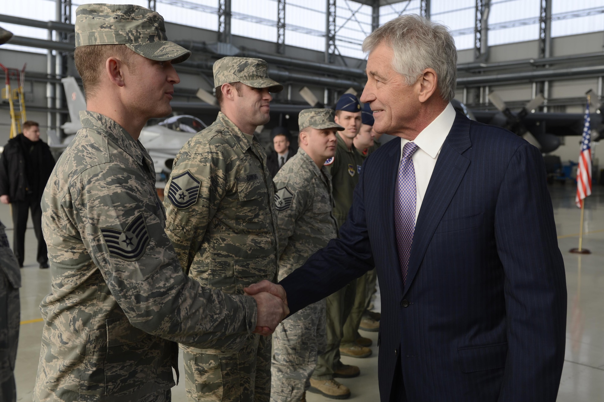 Tech. Sgt. Brian Williams receives a handshake from Secretary of Defense Chuck Hagel Jan. 31, 2014, at Powidz Air Base, Poland. The Aviation Detachment's mission supports Poland’s continued defense modernization and standardization with the U.S. and the North Atlantic Treaty Organization. Williams is the 52nd Operations Group Aviation detatchment NCO in charge of client systems  (U.S. Air Force photo/Staff Sgt. Christopher Ruano)