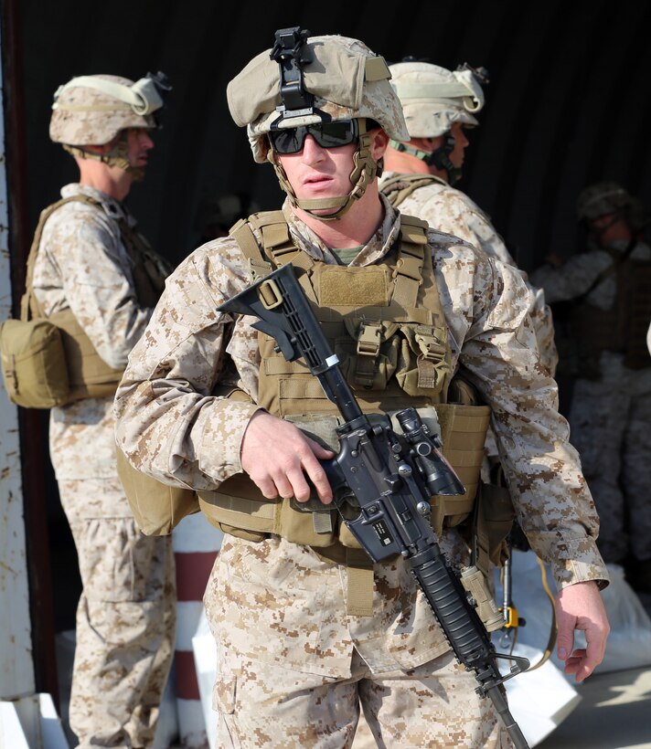 Sergeant Brent Wars, a landing support specialist with Black Sea Rotational Force 14, waits to load passengers and gear onto a KC-130 Hercules at Mihail Kogalniceanu, Romania, Nov. 16, 2013. Wars is Marine of the Week for his efforts in the delivery of ammunition and dedication to mission accomplishment, Jan. 24-31, 2014.

