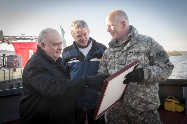 Under Secretary of the Army Joseph W. Westphal (left) is recognized by Col. Paul Owen, Commander, New York District, U.S. Army Corps of Engineers and Mr. Joseph Seebode, Deputy District Engineer (Programs & Project Management), New York District, U.S. Army Corps of Engineers, for his service and support of efforts by U.S. Army Corps of Engineers in January 2014. Westphal visited the New York District to observe the progress of the New York and New Jersey Harbor Deepening Project, receive various updates regarding the Corps’ efforts post Hurricane Sandy and recognize the Corps’ for their oversight of vital civil works projects. Once complete, the deepened channel will provide a safe and economically efficient pathway for the newest generation of container ships that will be calling at the Port of New York and New Jersey following the completion of the Panama Canal expansion in 2015.

Photo Credit: U.S. Army Staff Sergeant Bernardo Fuller 
