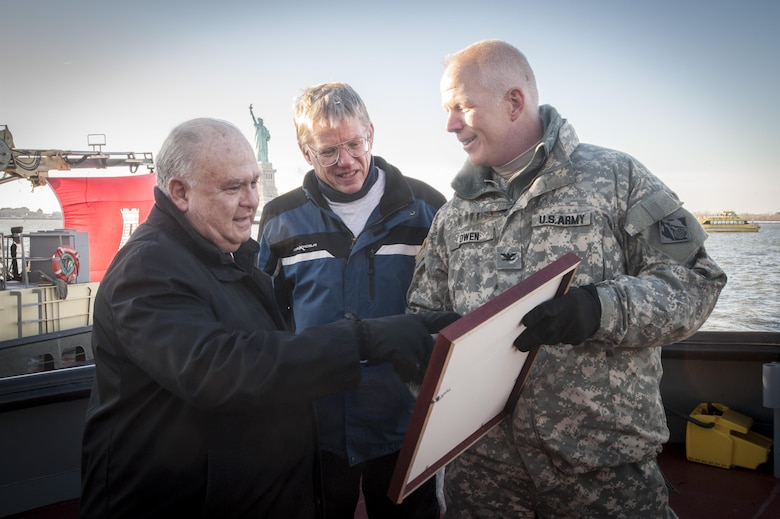 Under Secretary of the Army Joseph W. Westphal (left) is recognized by Col. Paul Owen, Commander, New York District, U.S. Army Corps of Engineers and Mr. Joseph Seebode, Deputy District Engineer (Programs & Project Management), New York District, U.S. Army Corps of Engineers, for his service and support of efforts by U.S. Army Corps of Engineers in January 2014. Westphal visited the New York District to observe the progress of the New York and New Jersey Harbor Deepening Project, receive various updates regarding the Corps’ efforts post Hurricane Sandy and recognize the Corps’ for their oversight of vital civil works projects. Once complete, the deepened channel will provide a safe and economically efficient pathway for the newest generation of container ships that will be calling at the Port of New York and New Jersey following the completion of the Panama Canal expansion in 2015.

Photo Credit: U.S. Army Staff Sergeant Bernardo Fuller 
