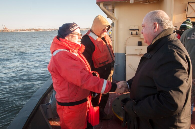 Under Secretary of the Army Joseph W. Westphal (right) thanks crew members aboard the U.S. Army Corps of Engineer vessel HAYWARD during a visit with the New York District to observe the progress of the New York and New Jersey Harbor Deepening Project in January 2014. Westphal met with leaders from the U.S. Army Corps of Engineers, North Atlantic Division and New York District to receive various updates regarding the Corps’ efforts post Hurricane Sandy and observe the Corps’ oversight of vital civil works projects. Once complete, the deepened channel will provide a safe and economically efficient pathway for the newest generation of container ships that will be calling at the Port of New York and New Jersey following the completion of the Panama Canal expansion in 2015.

Photo Credit: U.S. Army Staff Sergeant Bernardo Fuller 
