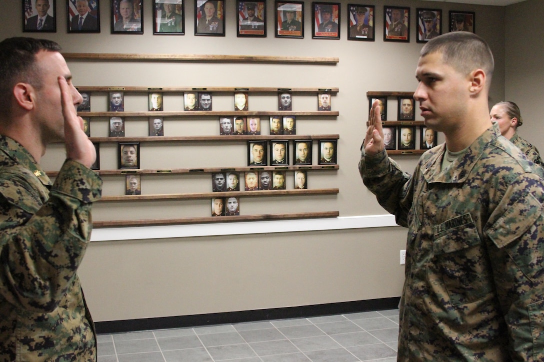 Maj. Andrew G. Gourgoumis, commanding officer of Recruiting Station Portsmouth recites the staff noncommissioned officer creed during Staff Sgt. Christopher Nieves’ meritorious promotion Jan. 3.  Nieves has been a canvassing recruiter for nearly two years and is slated to take over his own substation in Lawrence, Mass.