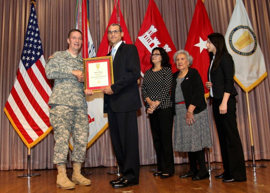 Pete Perez, the Southwestern Division director of business directorate is inducted into the Senior Executive Service, Jan. 30, 2014 in Washington, DC.