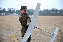 Lance Cpl. Kathryn White, a Motor Transportation Operator with Combat Logistics Battalion 6, 2nd Marine Logistics Group performs functions checks on a Raven unmanned aerial vehicle during the practical application portion of training aboard Camp Lejeune, N.C., Feb. 4, 2014.  Once the checks were completed the Raven was launched and flew through the skies over Camp Lejeune for 20 minute intervals. (U.S. Marine Corps photo by Lance Cpl. Shawn Valosin)